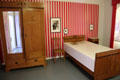 Bedroom of Bertolt Brecht's mother with sturdy wooden furniture at Brechthaus Museum. Augsburg, Germany.
