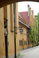 Houses with steeply gabled roofs within walls of Fuggerei. Augsburg, Germany.