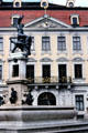 Facade of Stadtische Kunstsammilungen with fountain of St George Slaying Dragon. Augsburg, Germany.