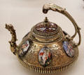 Ornate silver teapot with enameling on copper & adorned with six porcelain medallions depicting Greek Gods by goldsmith Esaias II Busch & unknown enameller from Augsburg at Maximilian Museum. Augsburg, Germany.