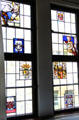Antique stained glass panels mounted in window at Coburg Castle. Coburg, Germany.