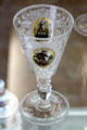 Engraved clear glass goblet lacquer painted with hunter & deer from Bohemia at Coburg Castle. Coburg, Germany.