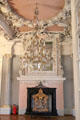 Chandelier & fireplace in Hall of Giants at Ehrenburg Palace. Coburg, Germany.
