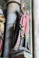 Carving of St. Catherine of Alexandria with wheel & sword symbols at St. Sebaldus Church. Nuremberg, Germany.