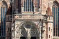 Central porch flanked by two stair towers decorated with saints & heraldic shields on Frauen Kirche. Nuremberg, Germany.