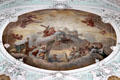 Baroque ceiling painting of holy trinity surrounded by saints in heaven at Gößweinstein pilgrimage basilica. Gößweinstein, Germany.