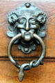 Cast metal door pull with horns & snake at Gößweinstein pilgrimage basilica. Gößweinstein, Germany.