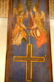 Painted panel with angels holding cross at Germanisches Nationalmuseum. Nuremberg, Germany.