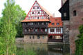 Half timber building beside Water Tower over Pegnitz River. Nuremberg, Germany.