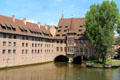 Heritage building with Chörlein bay window spans Pegnitz River. Nuremberg, Germany.