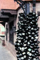 Empty wine bottles hanging from pole. Nuremberg, Germany.