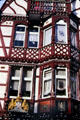 Ornate half-timbered style building facade on Wettergasse. Marburg, Germany.