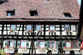 Half-timbered building with typical window boxes & inset dormer windows. Maulbronn, Germany.
