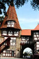 Historic wood framed building with conical tiled roof incorporating a city gate in Bavaria. Germany