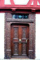 Ornate doorway , with intricate carvings & metal pull on Winter'sches Haus. Nördlingen, Germany.