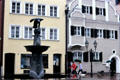 Streetscape with fountain topped by eagle. Donauwörth, Germany