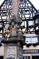 Detail of St. George's fountain , with Renaissance era column decorations on market square. Rothenburg ob der Tauber, Germany.