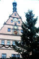 Ratstrinkstube with town clock, sundial & date display overlooking market square. Rothenburg ob der Tauber, Germany.