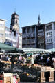 Outdoor market at City Hall square with Stiftskirche in background. Stuttgart, Germany.