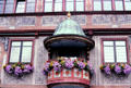 Small covered flower bedecked balcony on Rathaus. Tübingen, Germany.
