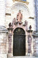 Entrance door to Zwiefalten Abbey church framed with statues & crowned by St Benedict of Nursia. Zwiefalten, Germany.