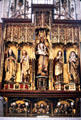 High altar with gilded Gothic sculptures of various saints & Madonna & Child centerpiece created by studios in Ulm. Blaubeuren, Germany.