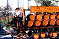 Traditional horse & wagon carrying wooden barrels of Tucher beer in town pageant. Ansbach, Germany.