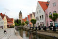 View along Hirschgasse canal looking to tower of Lutheran church of Our Lady. Memmingen, Germany.