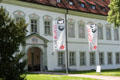 Entrance with banners of Salesians of Don Bosco who now dwell in Benediktbeuern Abbey. Germany.