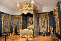 Ornately gilded bedroom set from Linderhof Palace at King Ludwig II Museum. Chiemsee, Germany