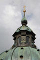 Cupola with golden finial cross atop dome of Ettal Benedictine Abbey. Ettal village, Germany.
