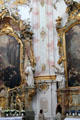 Detail of marble pillars & statues of saints between chapels at Ettal Benedictine Abbey. Ettal village, Germany.