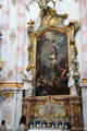 Baroque altar with painting of St. Sebastian being pierced by arrows at Ettal Benedictine Abbey. Ettal village, Germany.