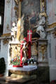 Baroque altar with painting of Holy Family at Ettal Benedictine Abbey. Ettal village, Germany.