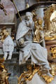 Sculpture of Bishop holding statue of Madonna & Child at Ettal Benedictine Abbey. Ettal village, Germany.