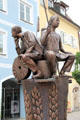 Brotbrunnen with baker & miller with his millstone on Schranenngasse in town center. Füssen, Germany