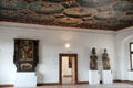 Works of art under carved wooden ceiling in State Gallery at Hohes Schloss zu Füssen. Füssen, Germany.