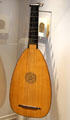 Renaissance era bass lute signed on a printed piece of paper, Magno Stegher, at Museum of City of Füssen in Kloster St Mang. Füssen, Germany.