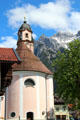 Church of Sts Peter & Paul with Alps foothills in background. Mittenwald, Germany.