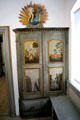 Wooden cabinet painted with figures in local dress at Oberammergau Museum. Oberammergau, Germany.