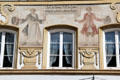 Two wine merchants painted on Marktstraße building. Bad Tölz, Germany.