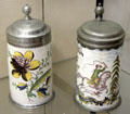 Ceramic covered beer steins with tin lids by Crailsheim at Ulmer Museum. Ulm, Germany.