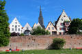 Ulm brick city wall overlooked by step gabled buildings & Ulm Münster. Ulm, Germany.