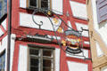 Sign for Zunfthaus with miniature canal boat on half-timbered building near Blau river. Ulm, Germany.