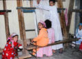 Children weaving carpets in Giza. Egypt.
