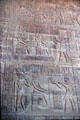 Carved scenes on walls inside Temple of Khnum in Esna. Egypt.