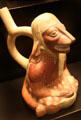 Moche ceramic stirrup-spout bottle figure with animal face from Peru at Museum of America. Madrid, Spain.