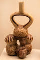 Moche ceramic stirrup-spout bottle with unusual inverted construction from Peru at Museum of America. Madrid, Spain.