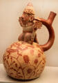 Moche ceramic stirrup-spout bottle with figure of warrior from Peru at Museum of America. Madrid, Spain.