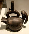 Chimu culture ceramic stirrup-spout bottle with bird from Peru at Museum of America. Madrid, Spain.